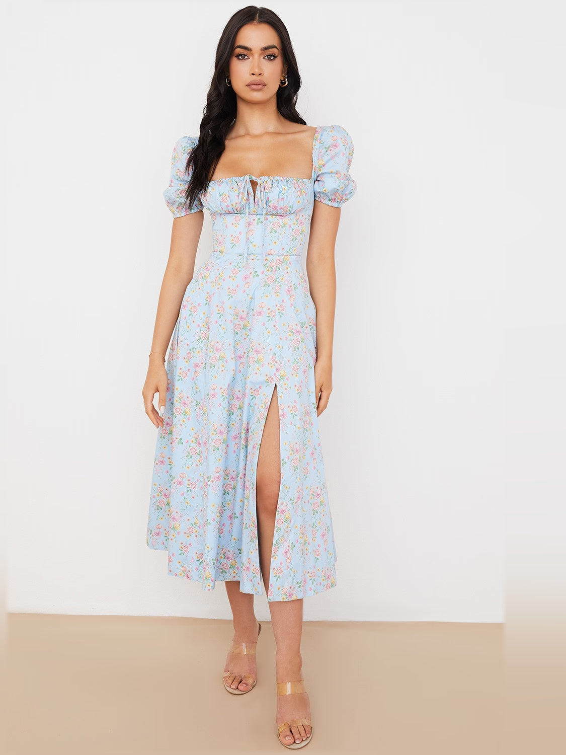 Light blue floral midi formal dress with puff sleeves, square neckline, and center slit