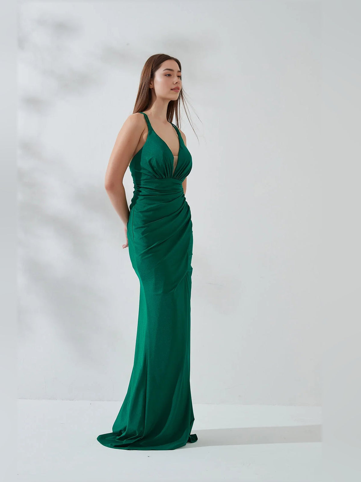 Dark green deep V-neck mermaid gown with ruched waist and long front slit