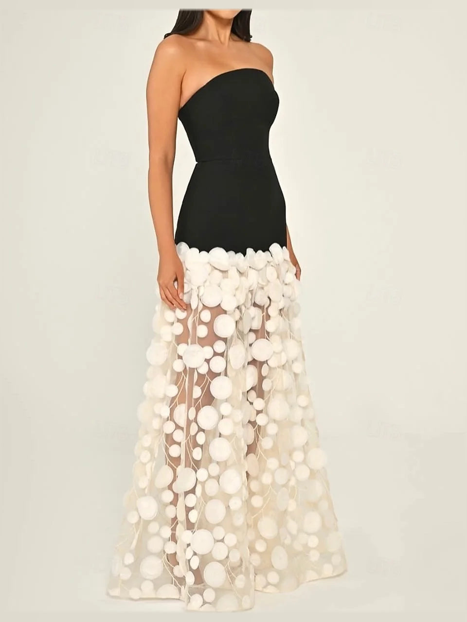 Strapless mermaid prom dress with black bodice and white layered tulle skirt