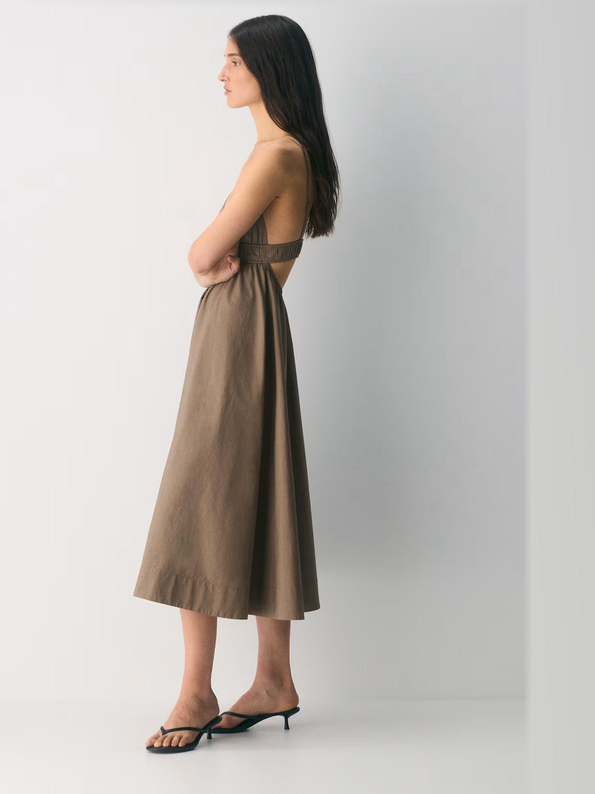 Taupe formal dress with structured woven fabric construction and maxi hem