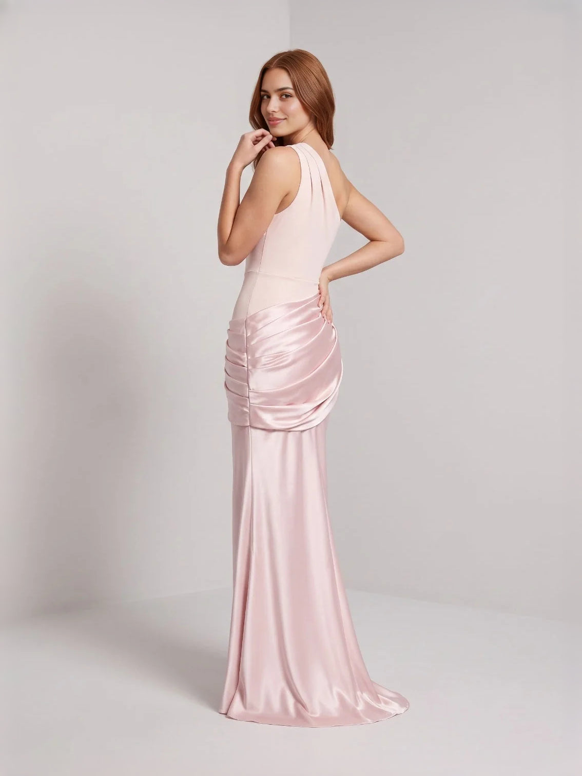 Light pink one-shoulder satin mermaid gown with draped ruched waist detail