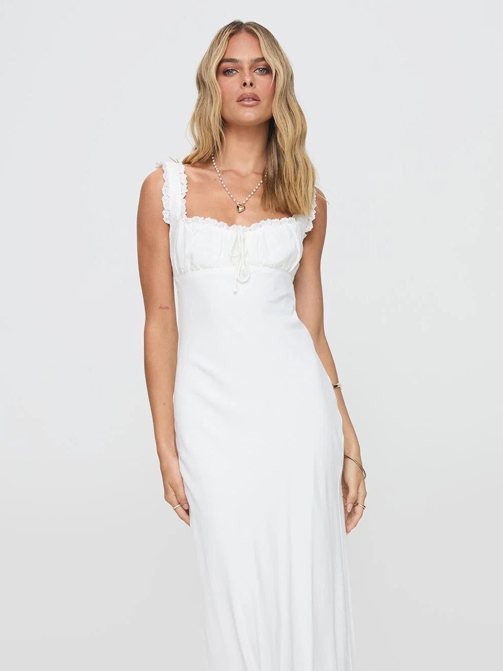 White formal dress with structured woven fabric construction and maxi hem