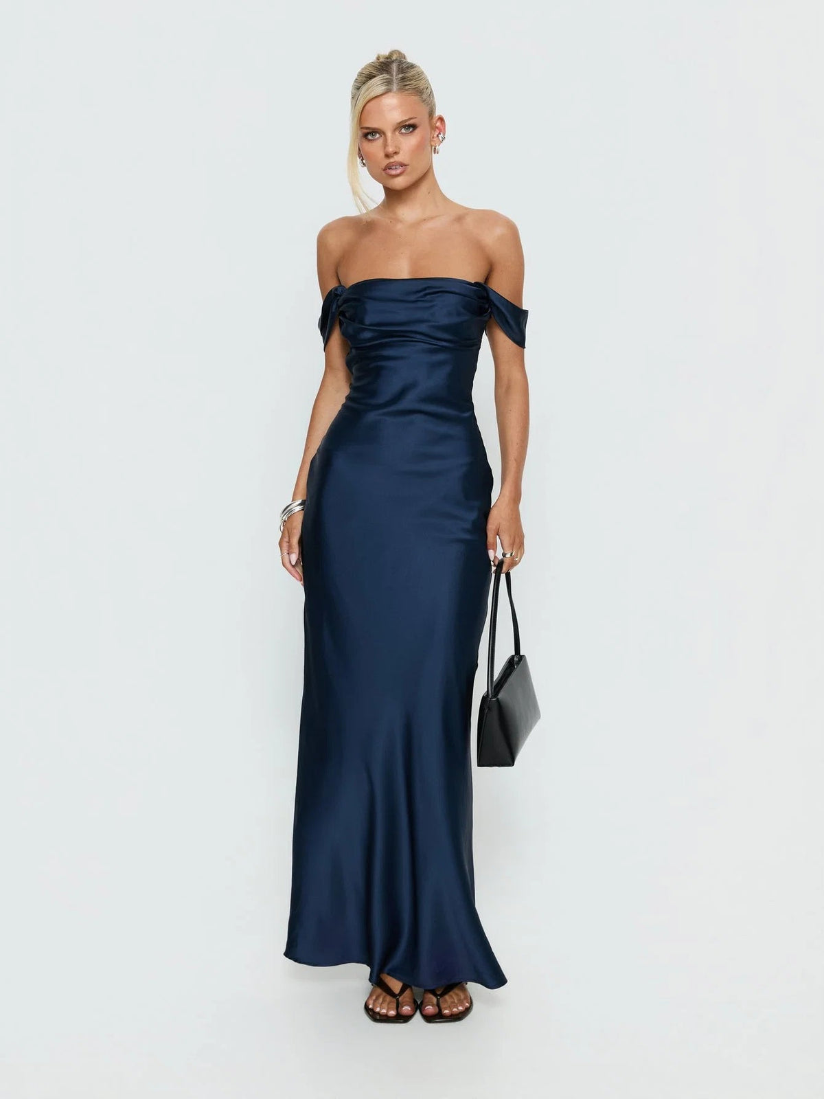 Navy formal dress with structured woven fabric construction and maxi hem