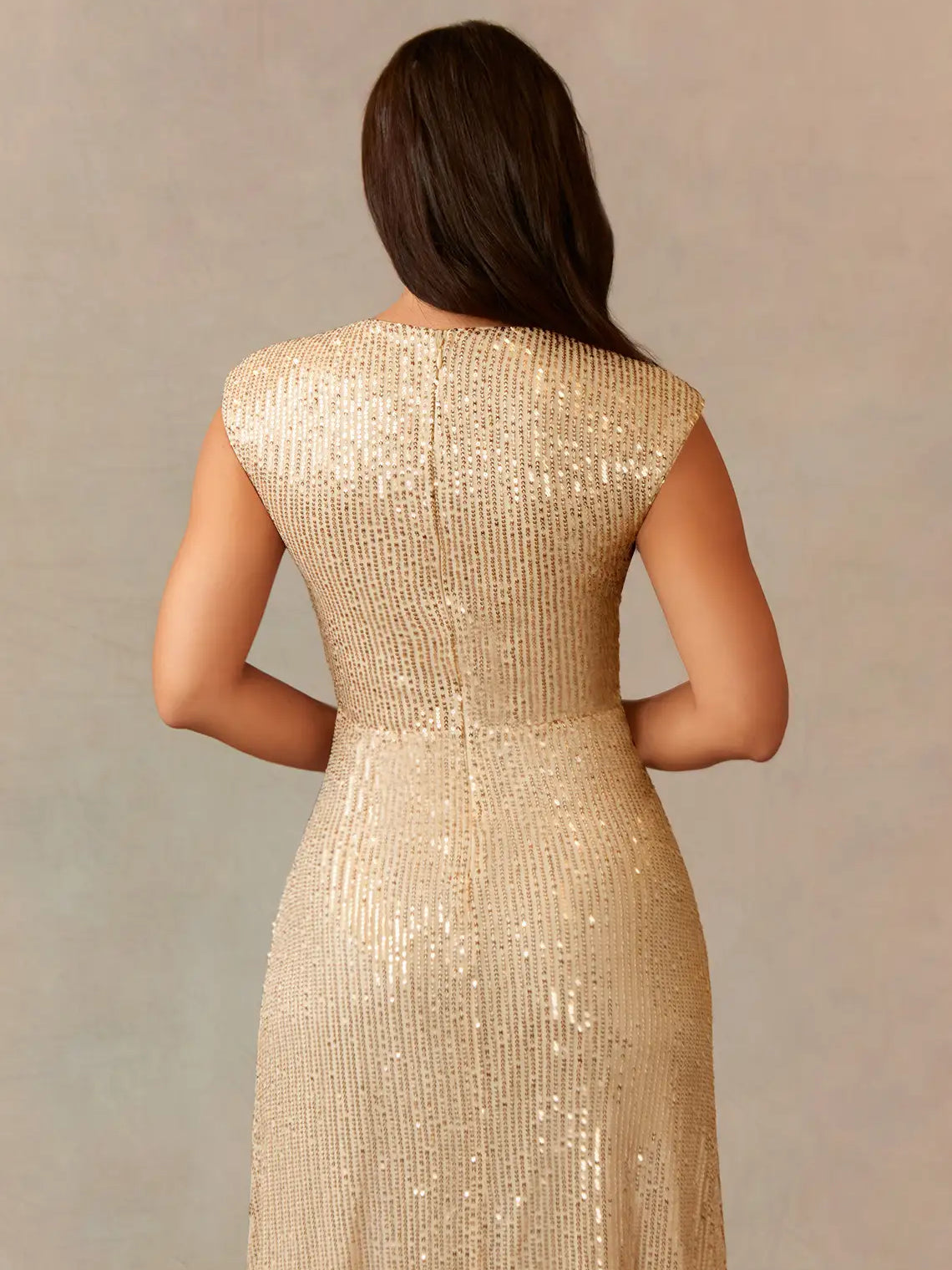 Back view of champagne sequin formal dress with V-neck and sleeveless ruching