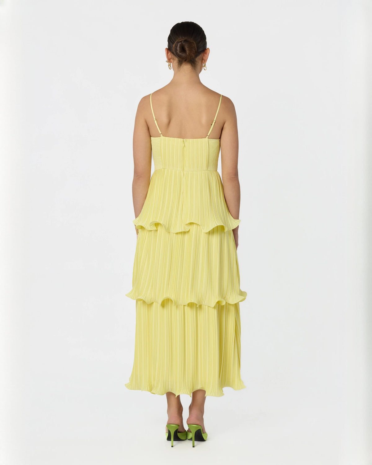 Light yellow sleeveless A-line maxi dress from back view with tiered pleated layers