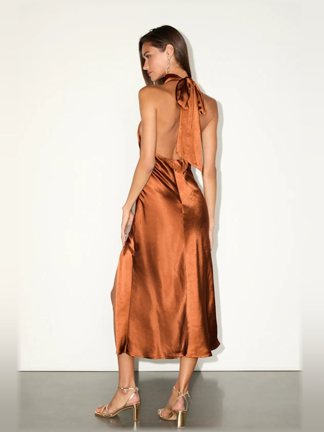 Rust satin halter backless midi dress from side-back view with draped ties