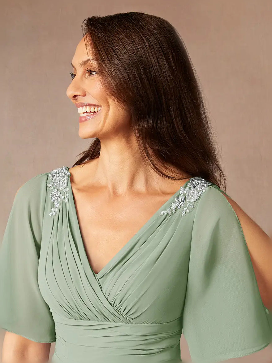 Dusty sage chiffon dress close-up, V-neck drape with ruffled trim on shoulders