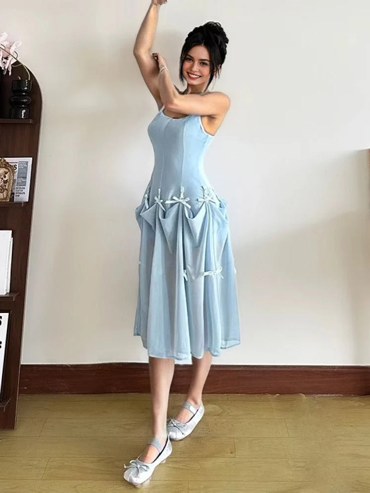 Light blue A-line maxi prom dress with scoop neck, spaghetti straps, tiered bow skirt