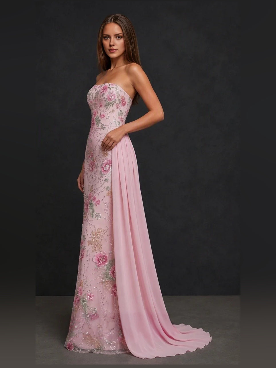 Blush pink strapless mermaid gown with floral applique bodice and flowing drape