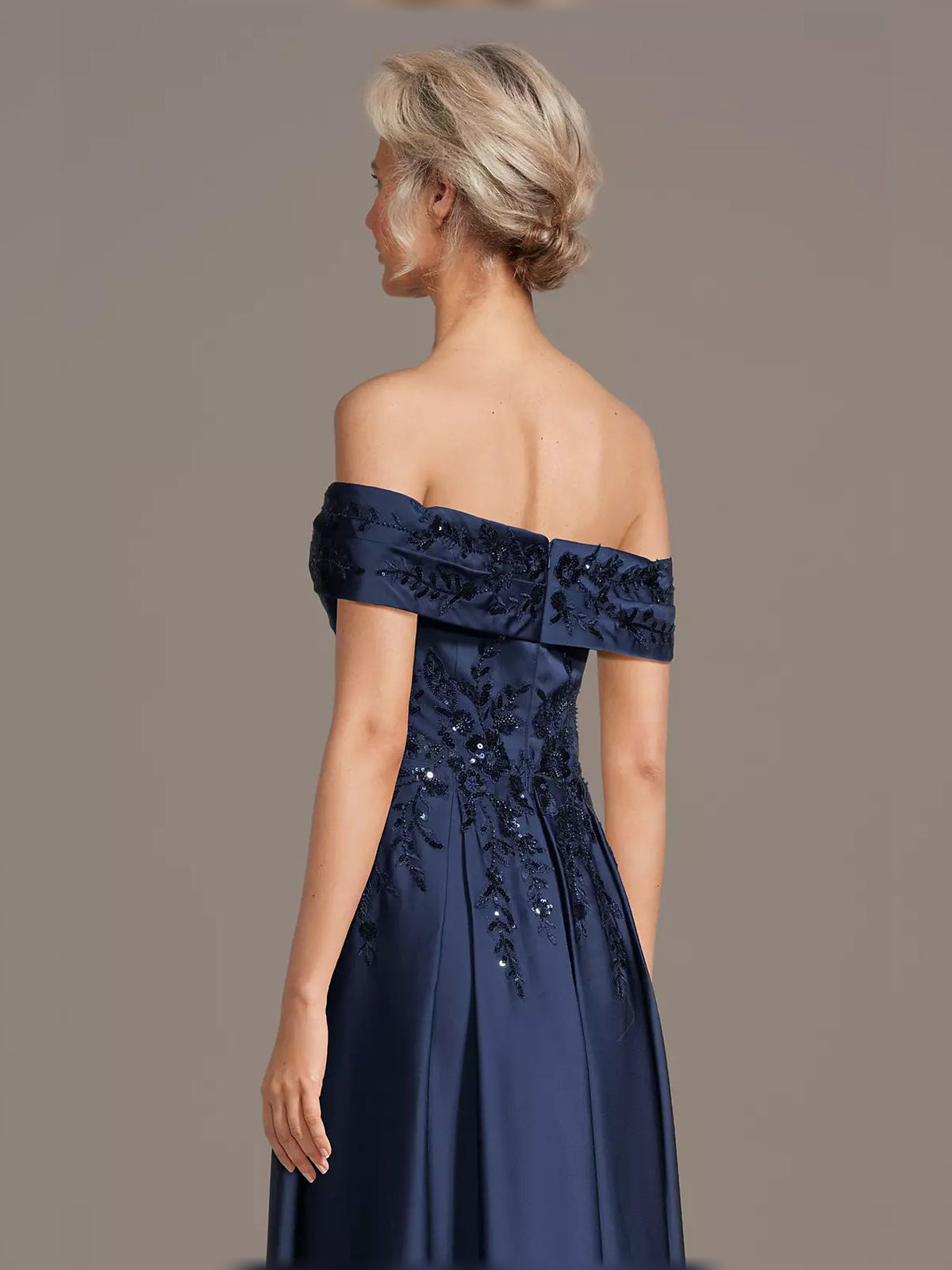 Dark navy off-shoulder maxi satin dress with floral sequin embroidery, side view