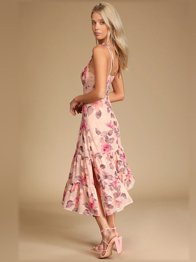 Pink floral tiered midi dress shown from side, with tie shoulder straps