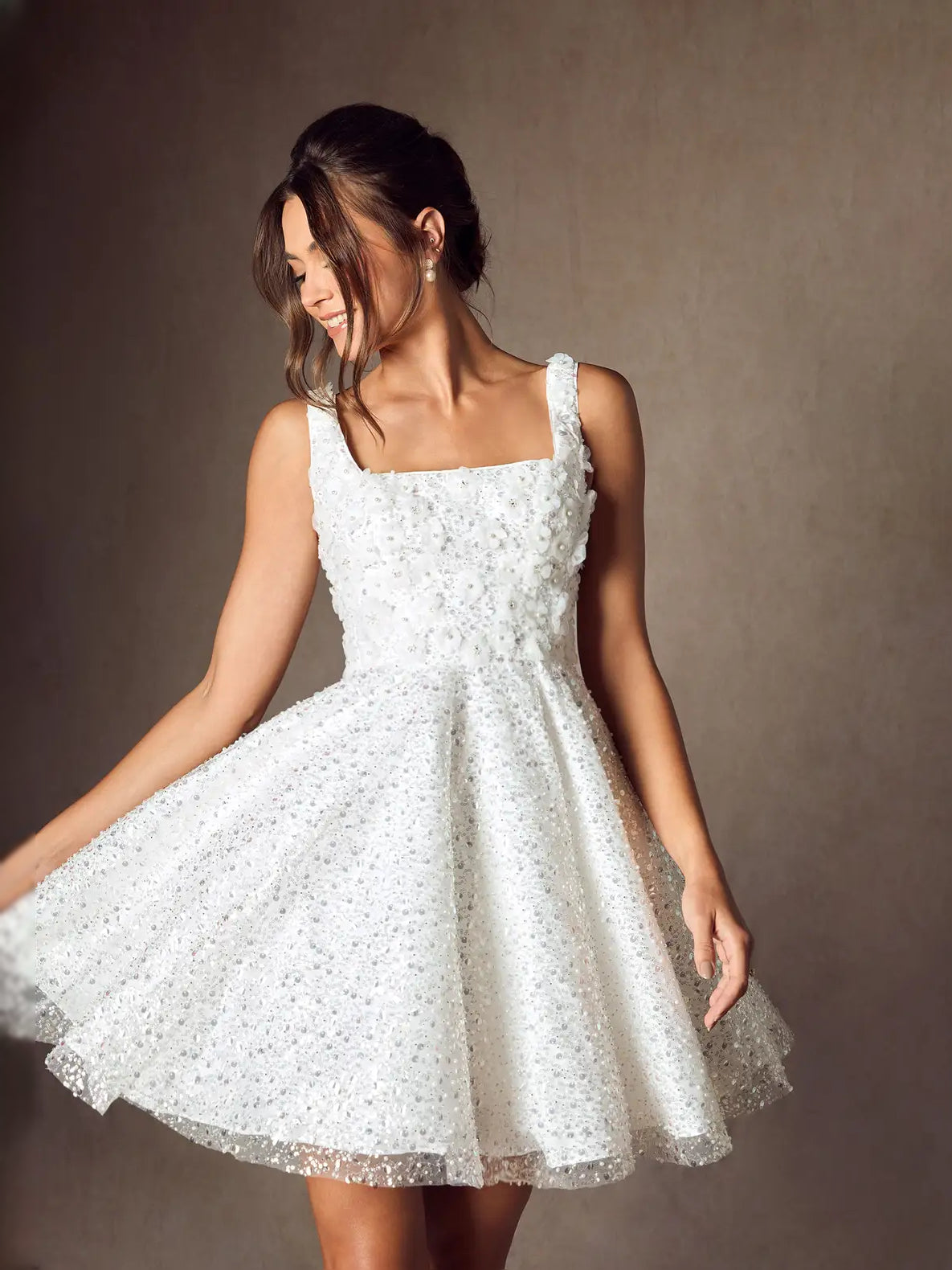 White square-neck A-line mini wedding dress in angled view with full flared skirt