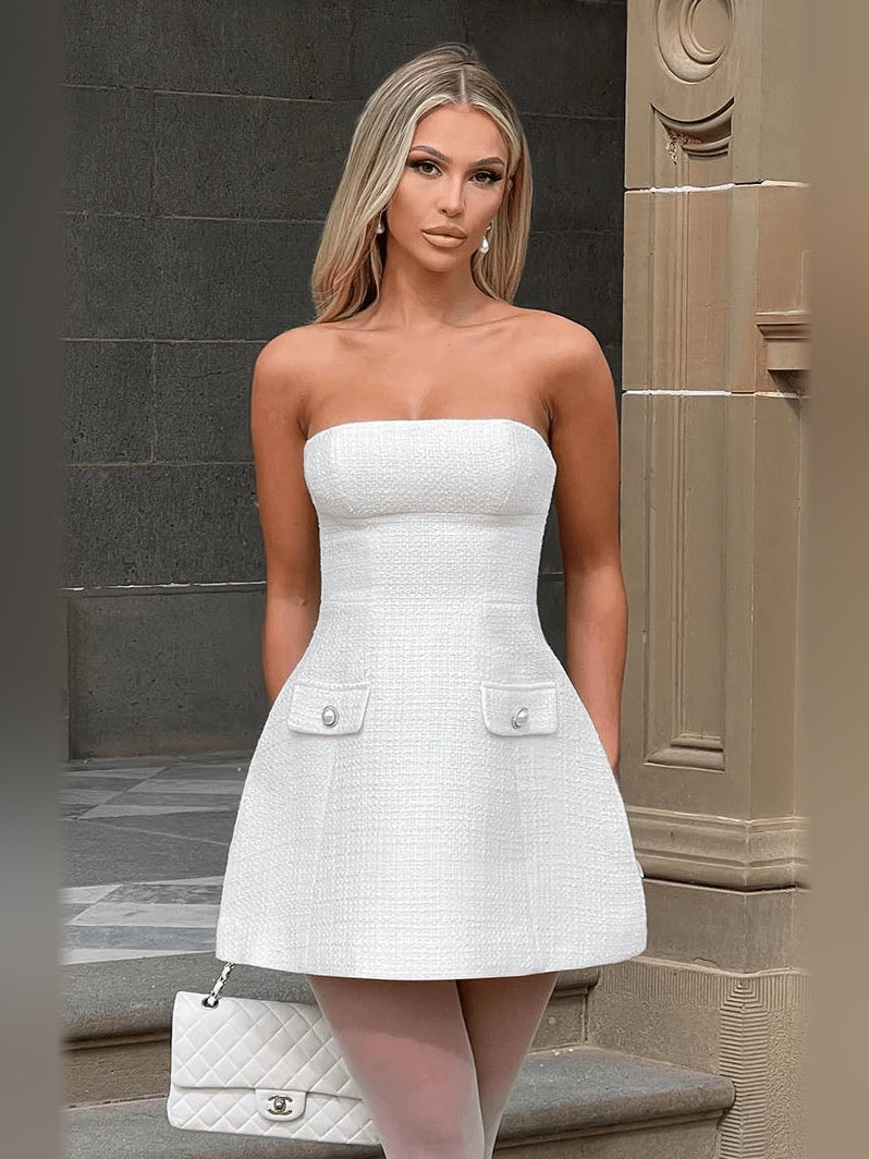 Ivory strapless mini dress with structured waist and two front flap pockets