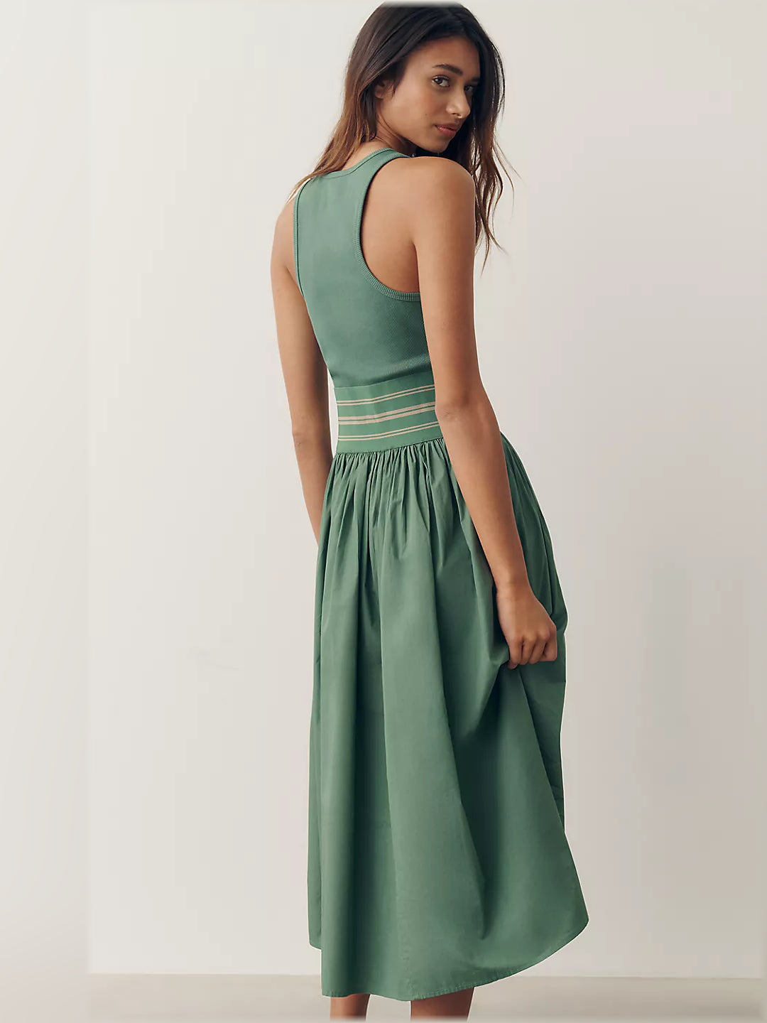 Green sleeveless midi dress, side view, horizontal banded bodice and gathered skirt