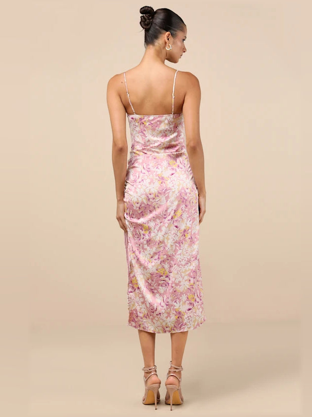 Back view of pink floral ruched midi dress with spaghetti straps and low back