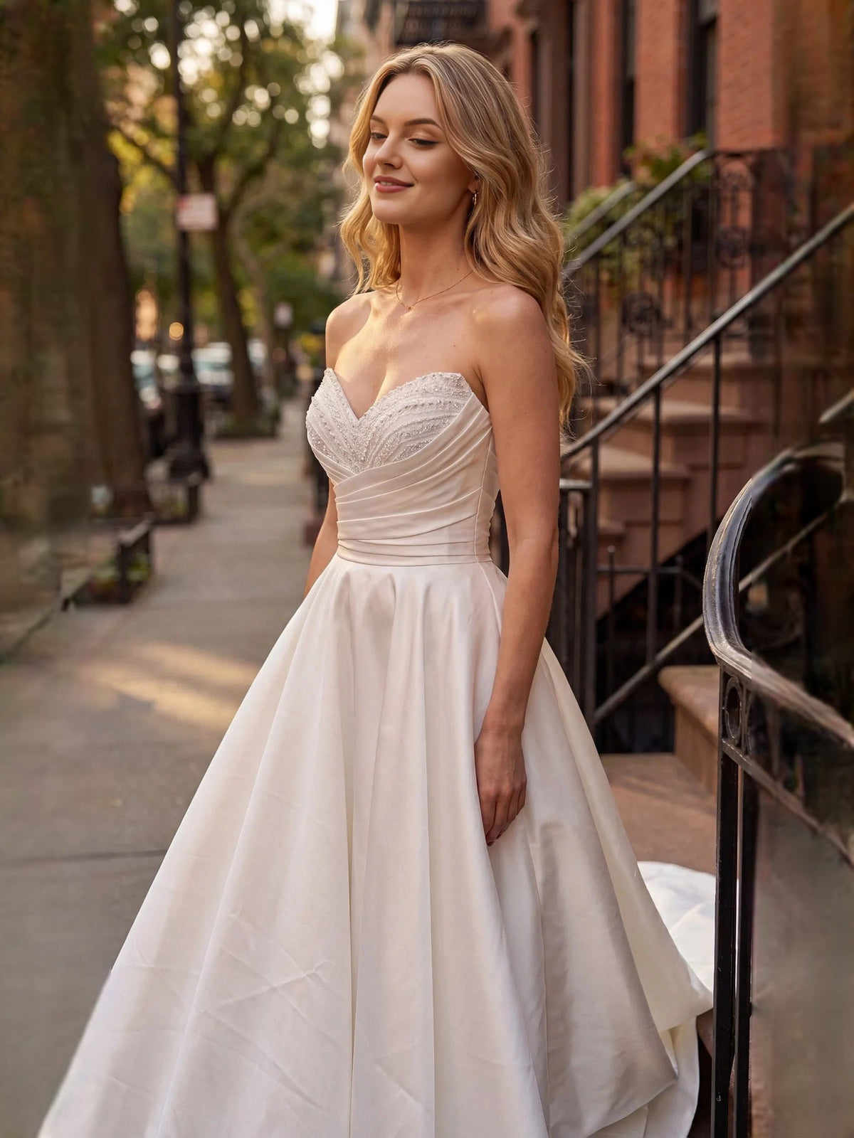 Ivory satin sweetheart wedding dress with ruched bodice and draped skirt, sleeveless