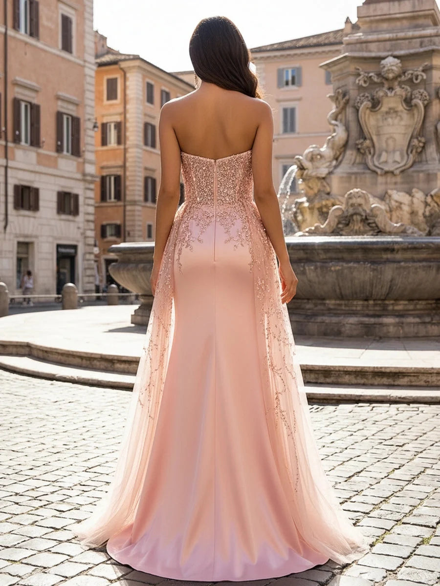Back view of blush pink sweetheart mermaid prom dress with beaded sequin lace detail