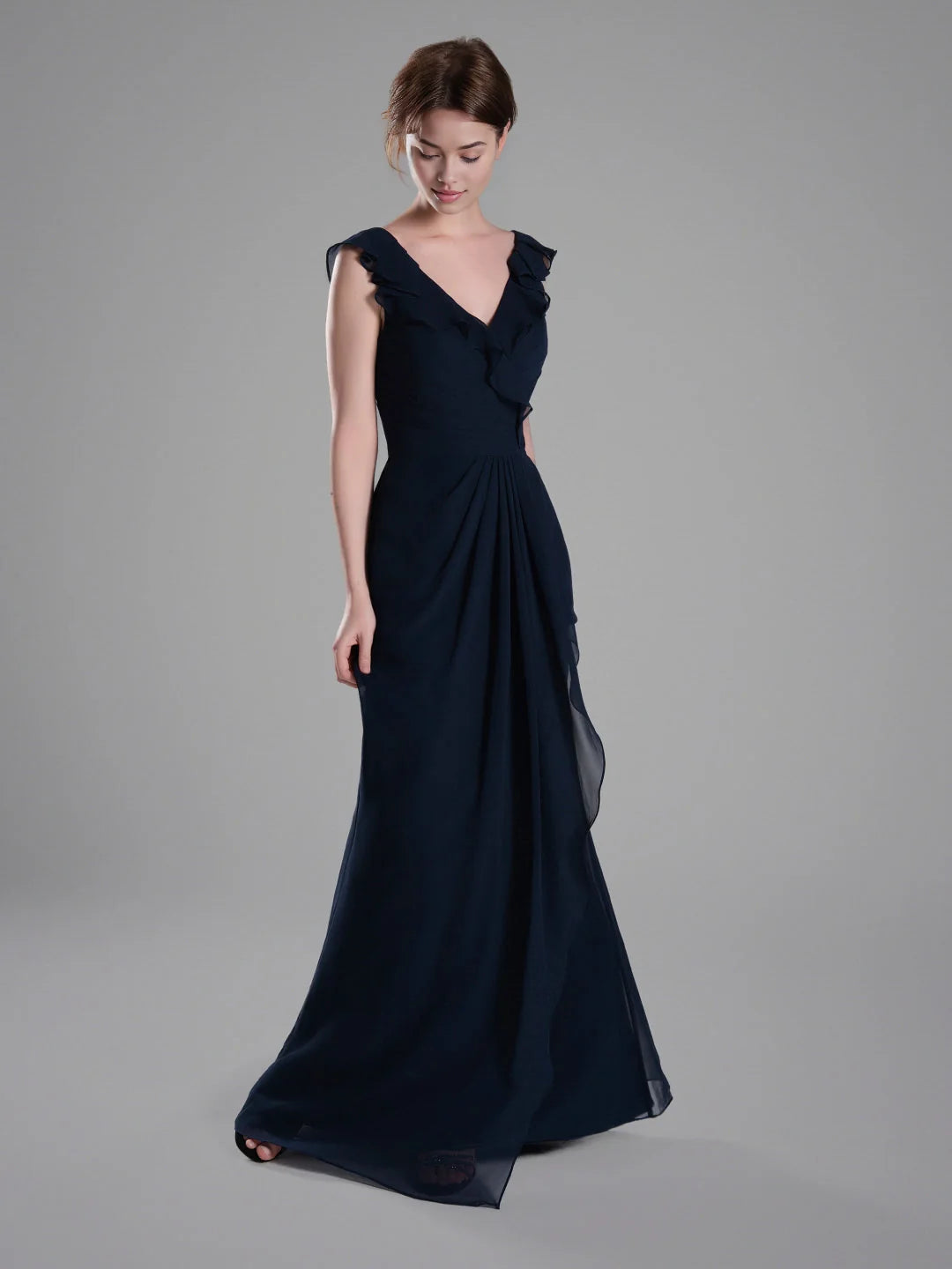 Dark navy chiffon bridesmaid dress with ruffled V-neck bodice and flowing A-line skirt