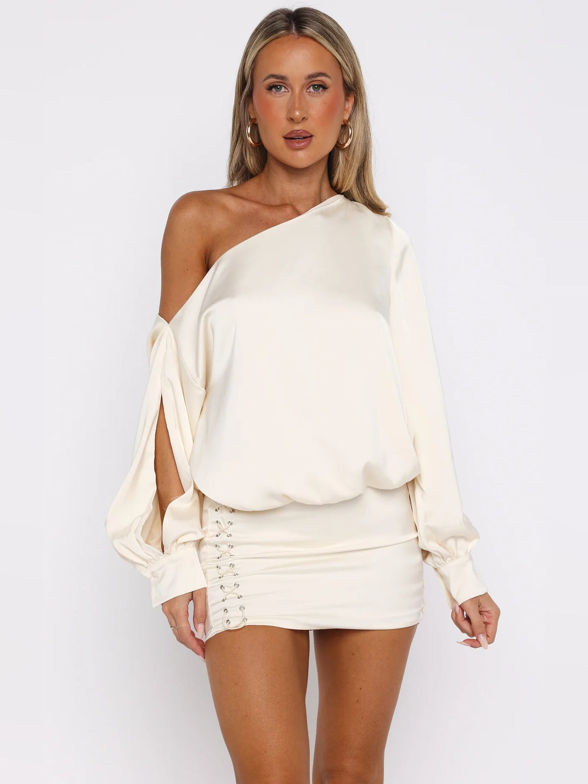 Off-white one-shoulder mini dress with long puff sleeves and corset-laced waistband