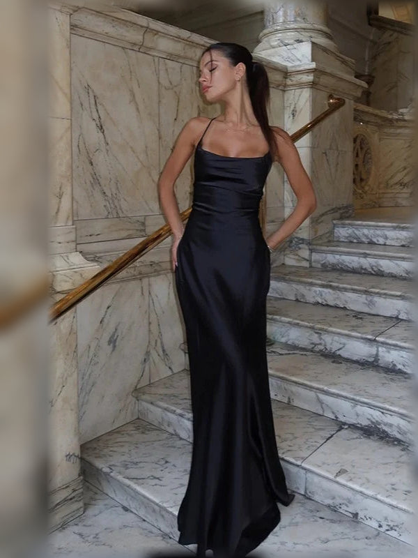 Black corset maxi dress with cowl neckline, thin straps, and open back