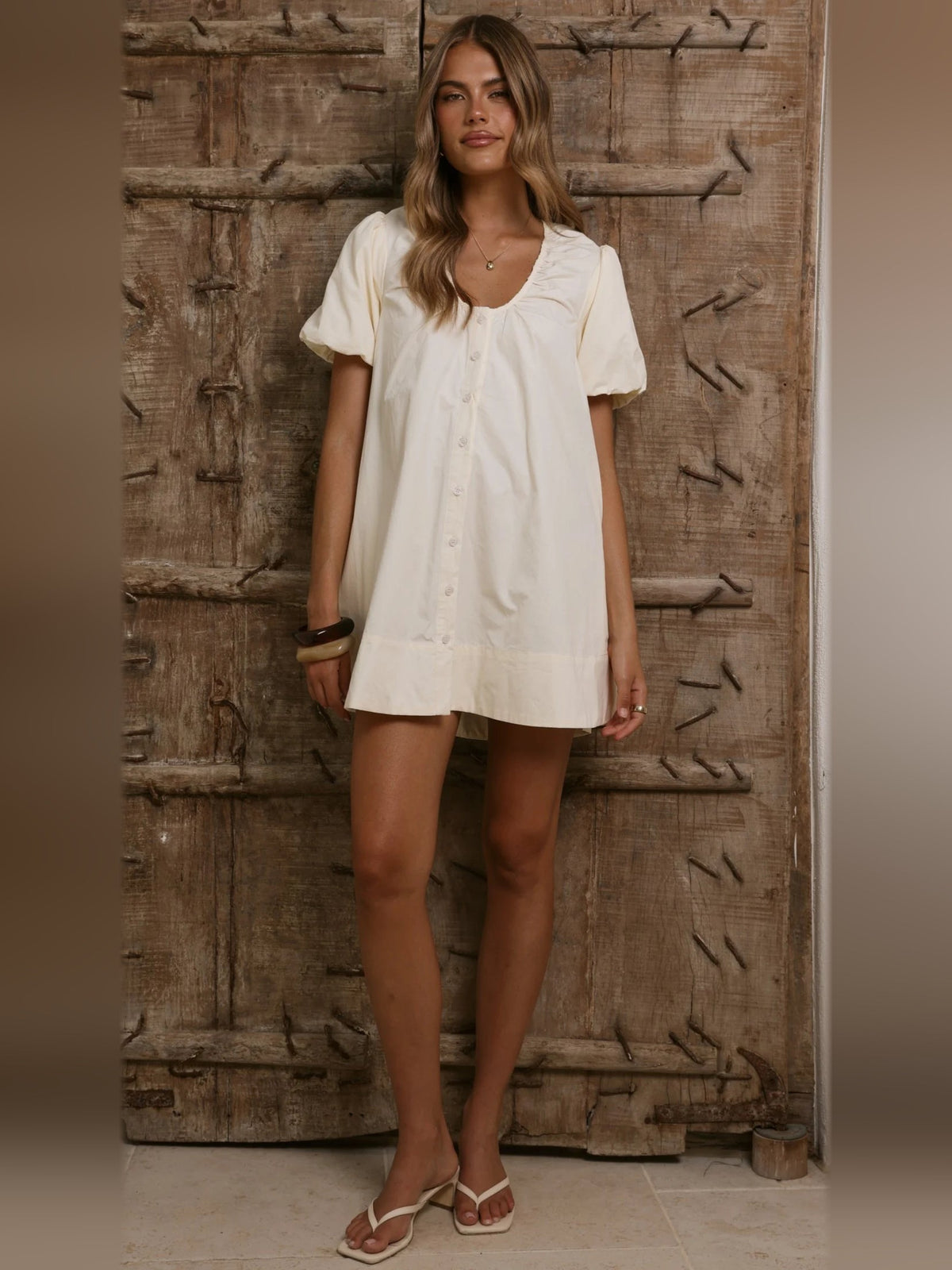 Butter button-front mini dress with short puff sleeves and straight hem, front view