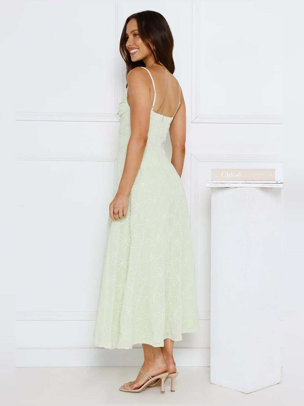 Mint midi formal dress, side view; spaghetti straps and textured floral pattern