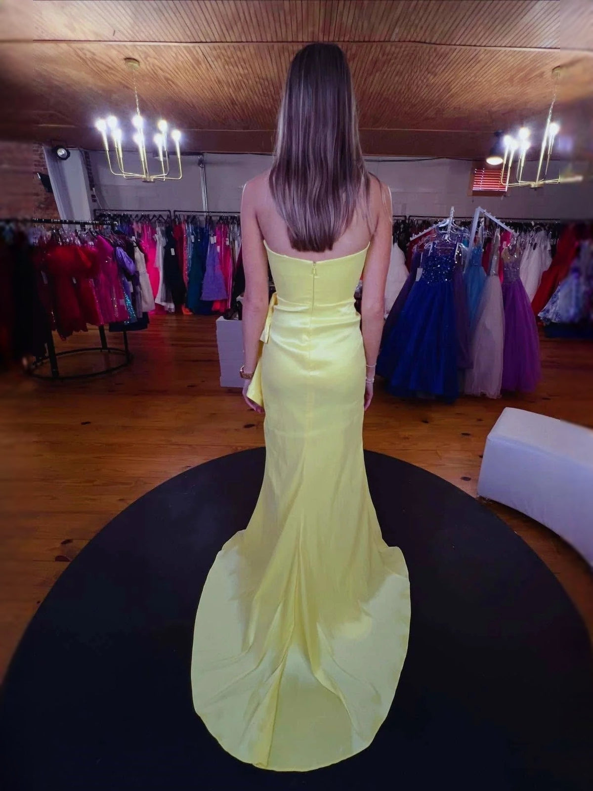 Lime strapless mermaid prom dress from back with open back and layered ruffles