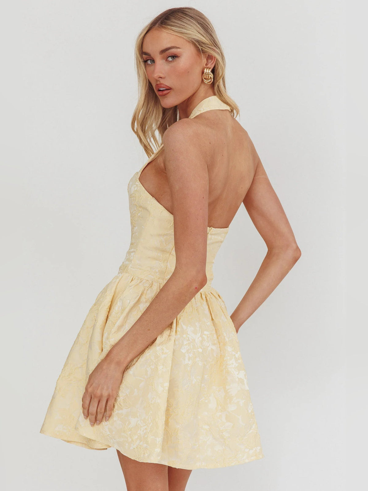 Butter halter mini dress open-back style, ruched waist and flared layered skirt