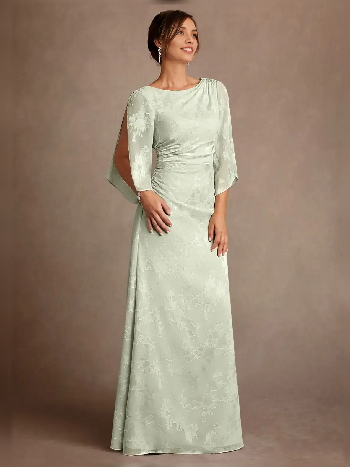 Mint green ruched column mother-of-the-bride dress with quarter-length cape sleeves