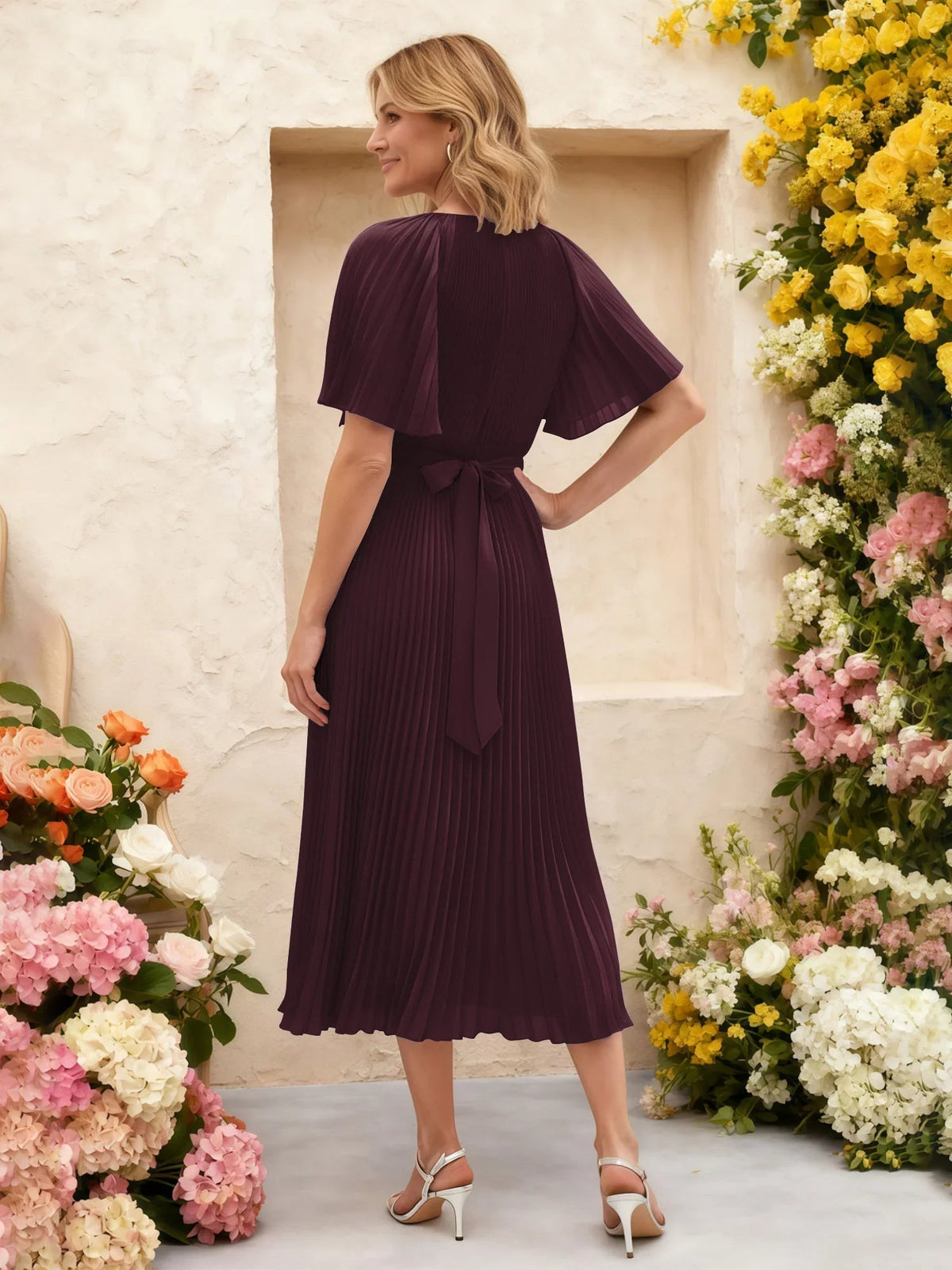 Cabernet pleated chiffon midi dress with flutter sleeves and floral waist tie detail