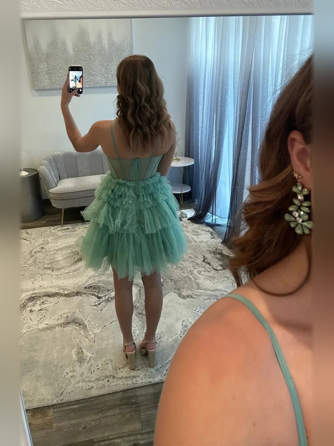 Back view: dusty sage tiered tulle mini dress with corset-style crisscross straps