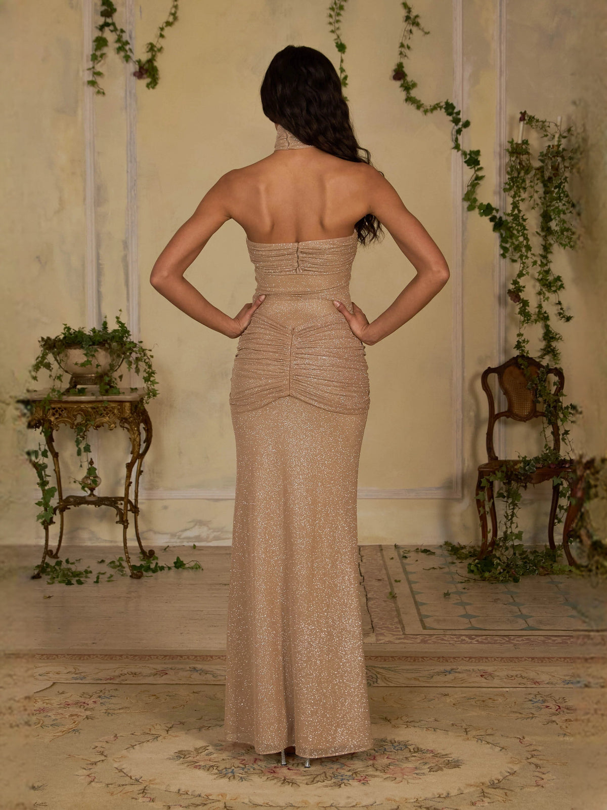 Back view: champagne glitter mermaid maxi prom dress with ruched center detail