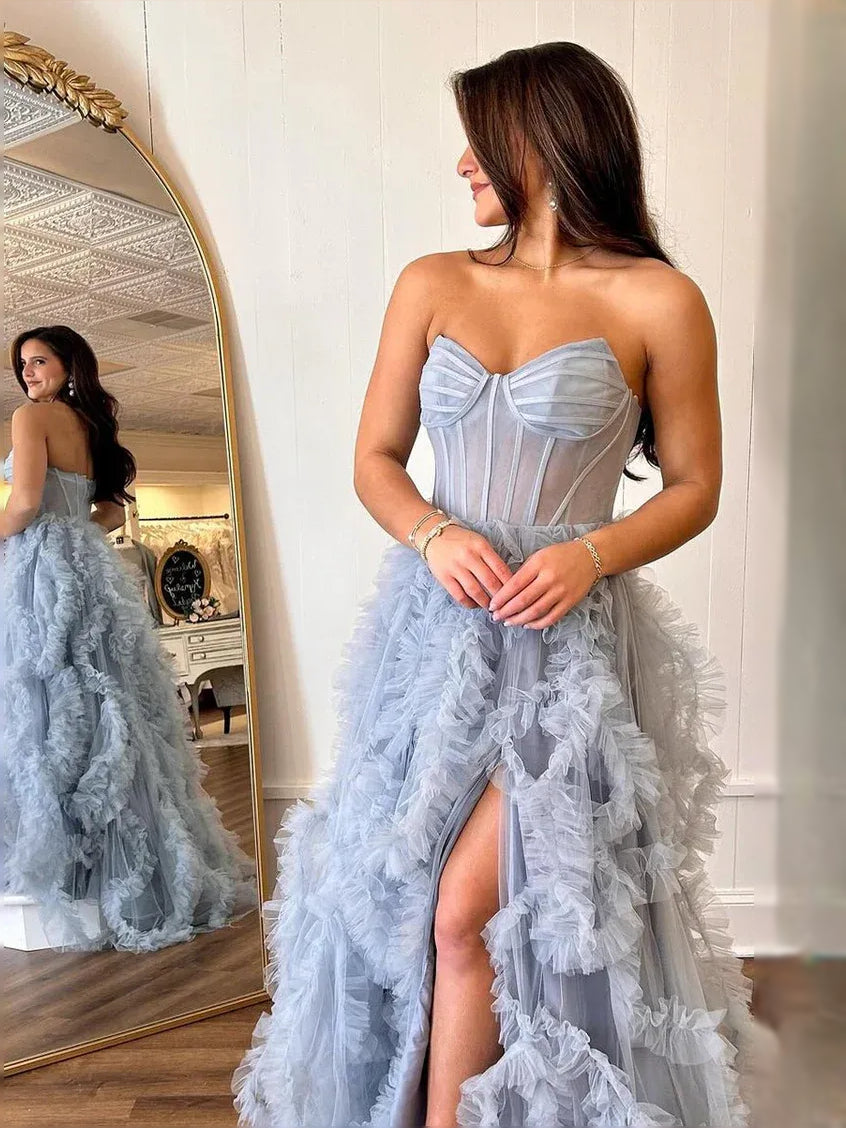 Dusty blue corset prom dress with sweetheart back detail and ruffled tulle slit skirt
