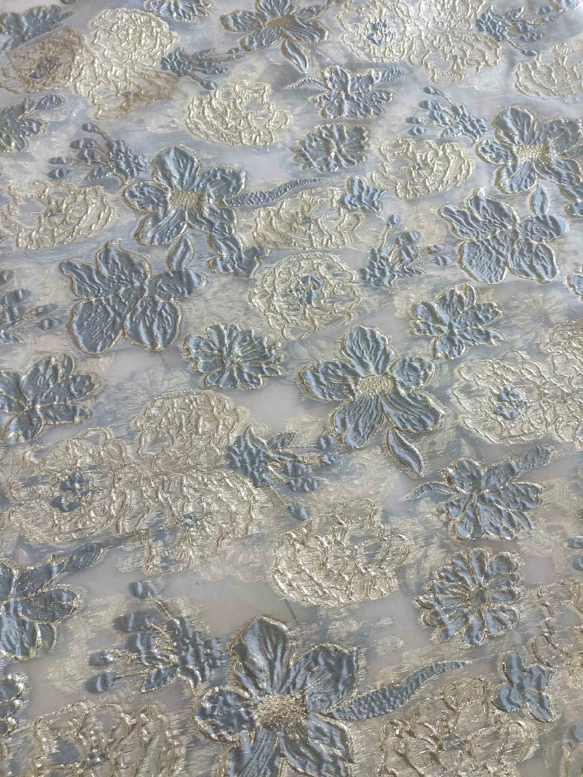Light blue floral jacquard fabric with raised 3D flower texture