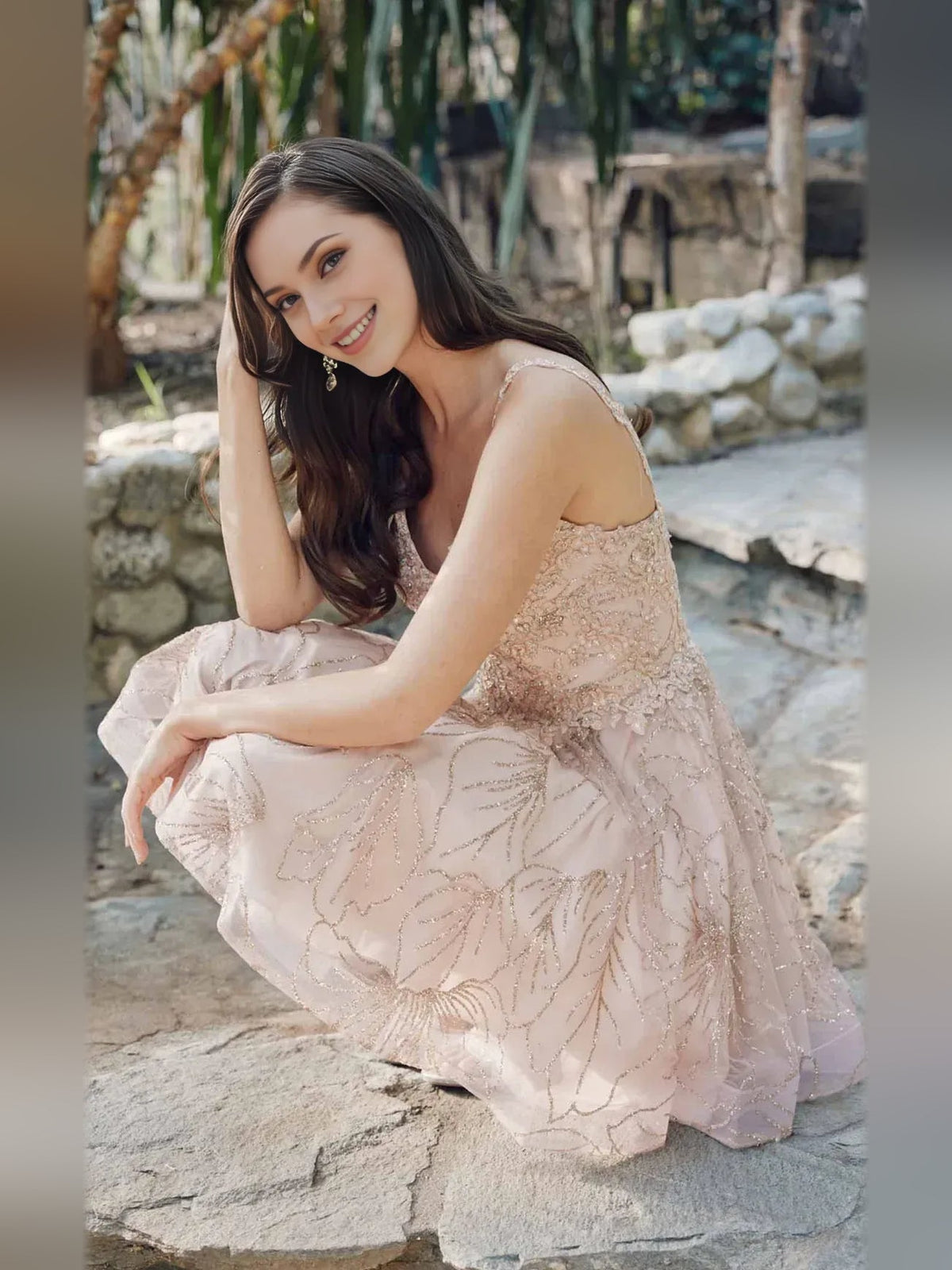 Champagne embroidered floral tulle mini dress with V-neck corset bodice, seated pose