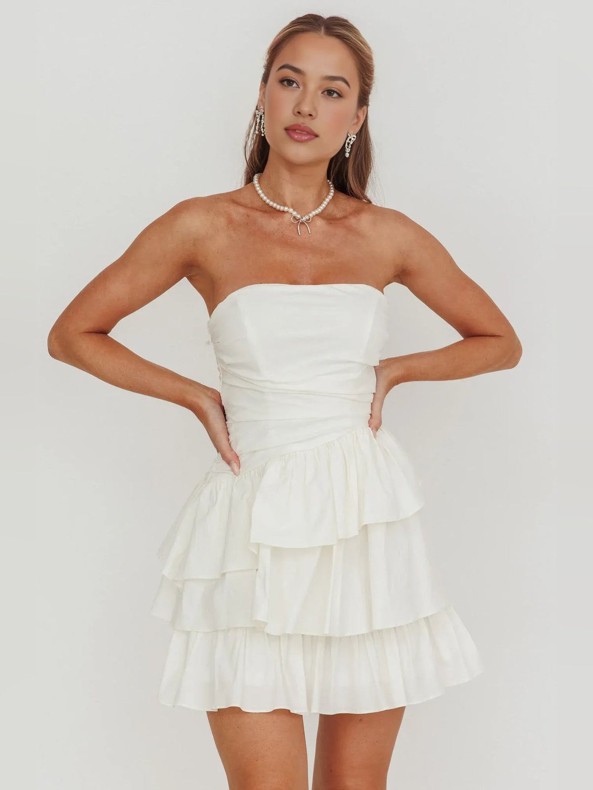 Ivory strapless mini A-line dress with ruched bodice and layered ruffle tiers