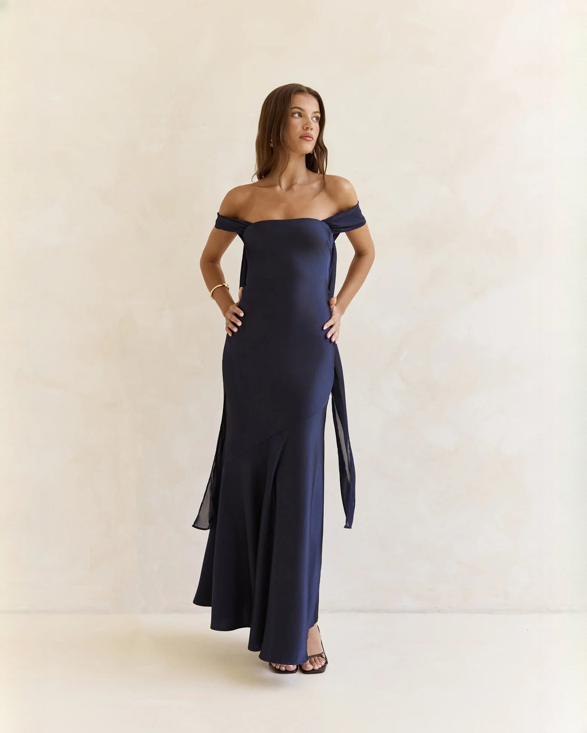 Navy satin off-shoulder A-line maxi dress with hanging side sash ties
