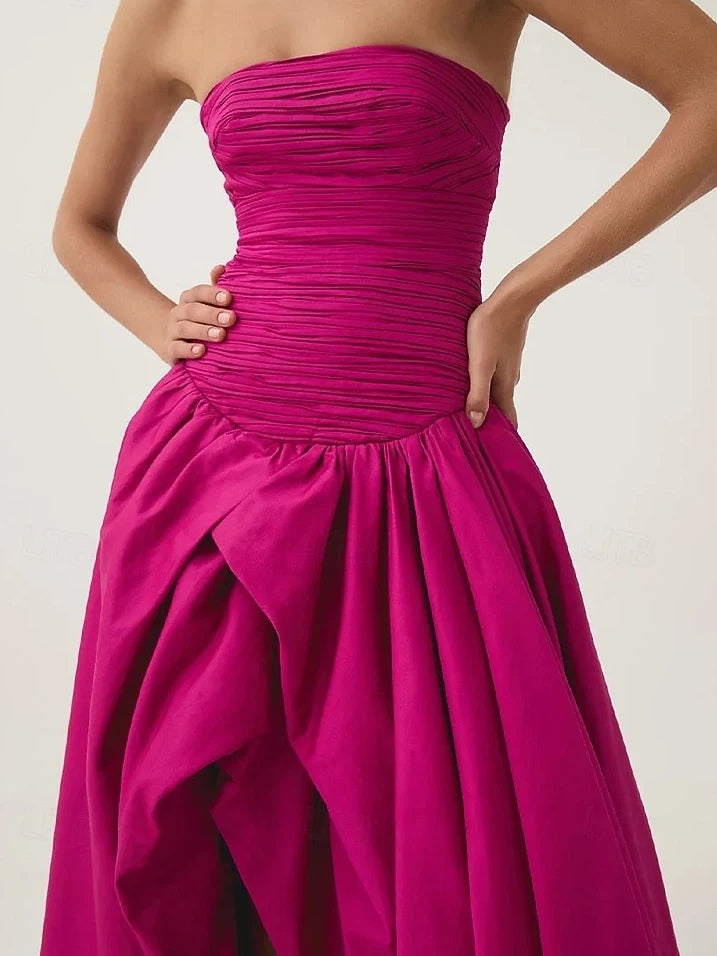 Hot pink strapless maxi dress with ruched bodice and gathered waist ruffle skirt