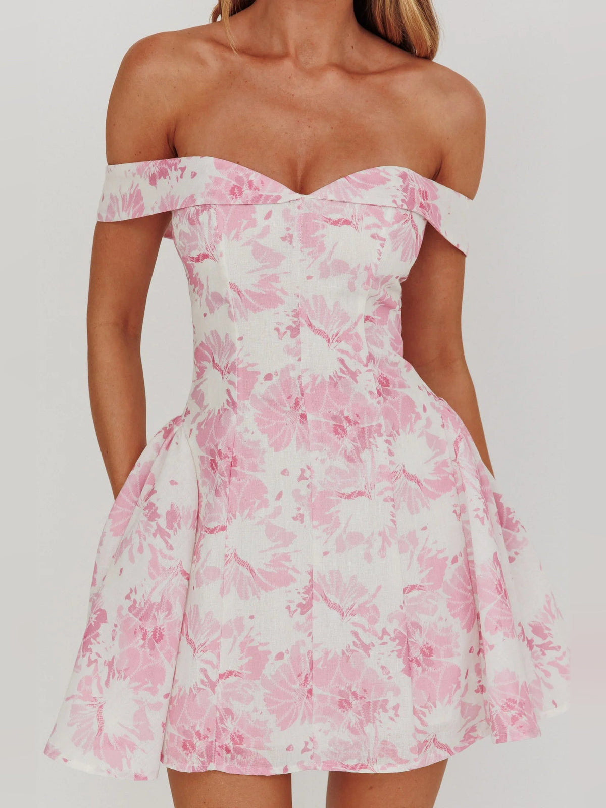 Pink floral off-shoulder mini dress neckline with sweetheart shape and gathered skirt