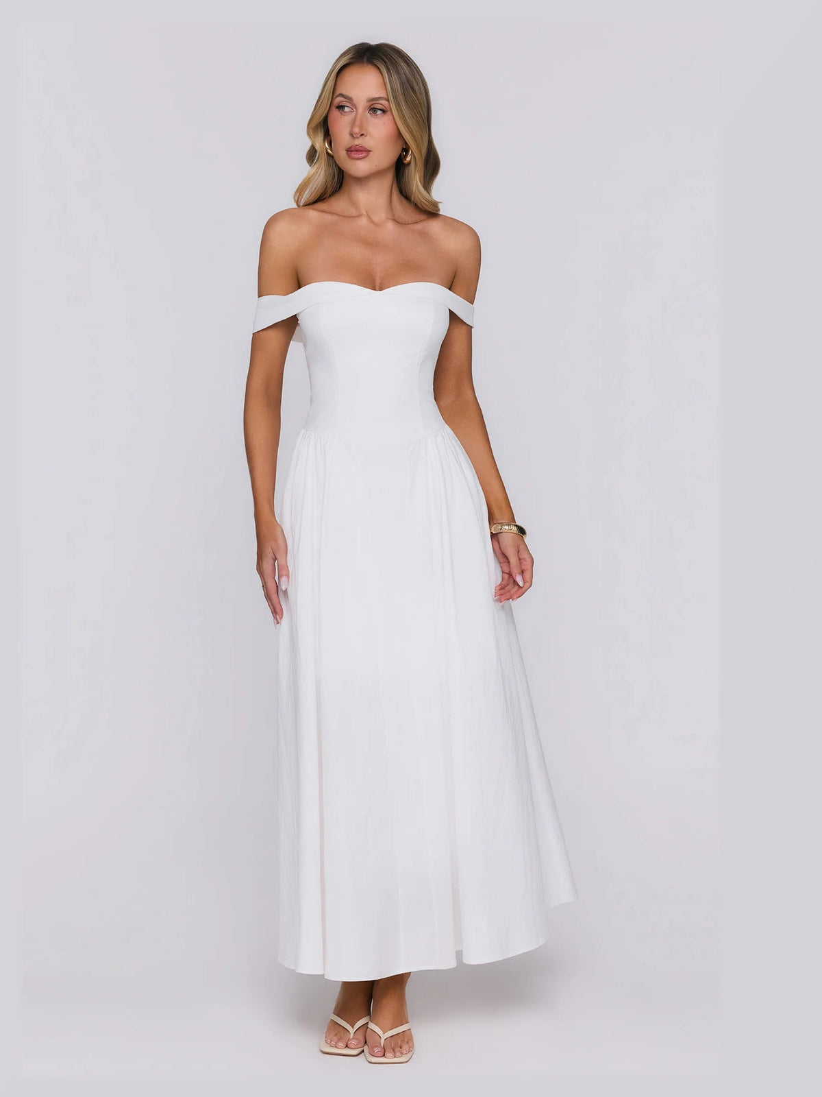 White formal dress with structured woven fabric construction and maxi hem