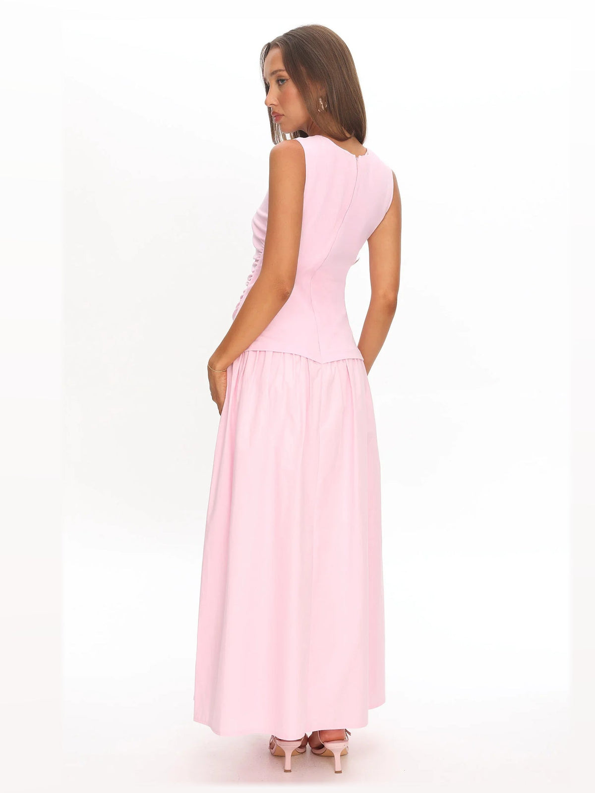 Pink formal dress with structured woven fabric construction and maxi hem