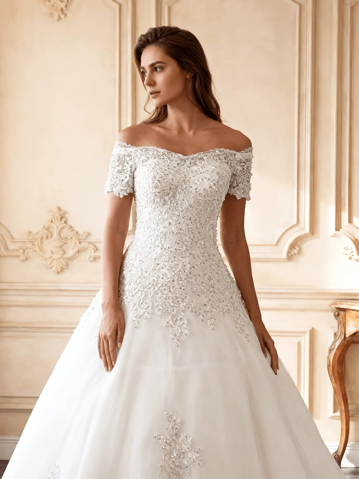 Ivory off-shoulder floral lace wedding gown with short sleeves and layered tulle skirt
