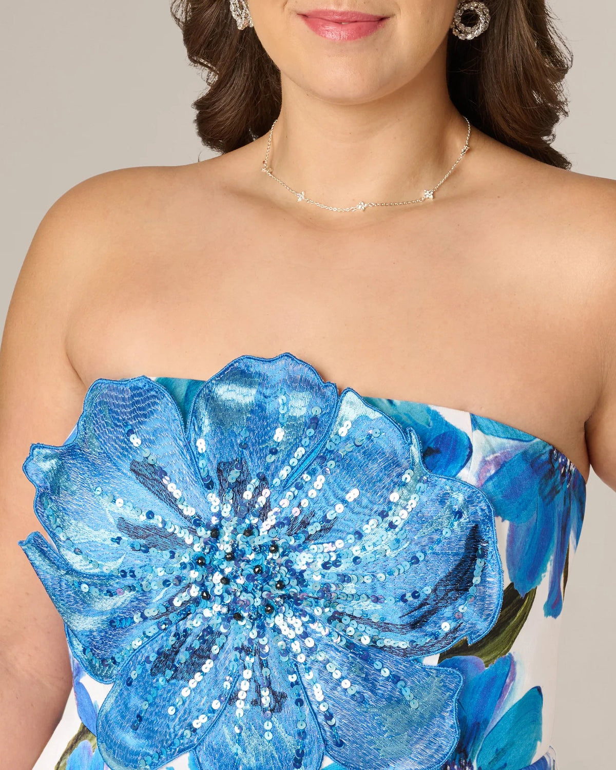 Close-up of strapless sweetheart bodice with blue floral sequin embellishment
