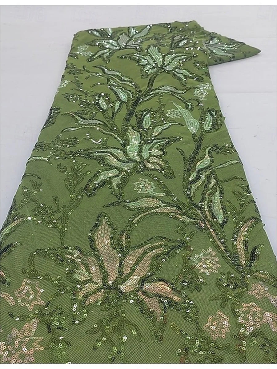 Green sequined embroidery detail on A-line gown fabric with round neckline