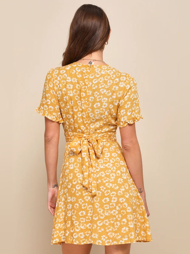 Yellow floral mini dress, open back design with gathered waist tie and flutter sleeves