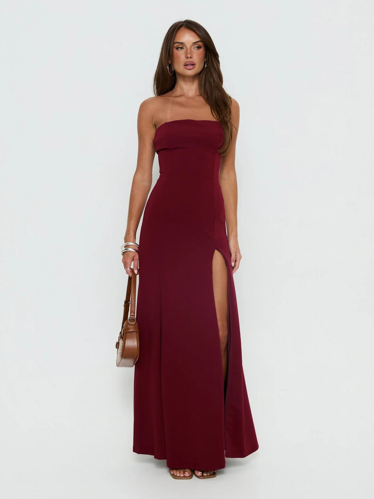 Burgundy formal dress with structured woven fabric construction and maxi hem