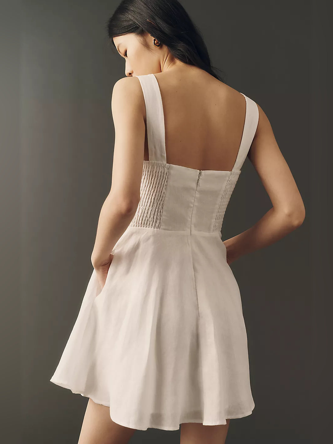 White square-neck mini dress with open back and thin shoulder straps
