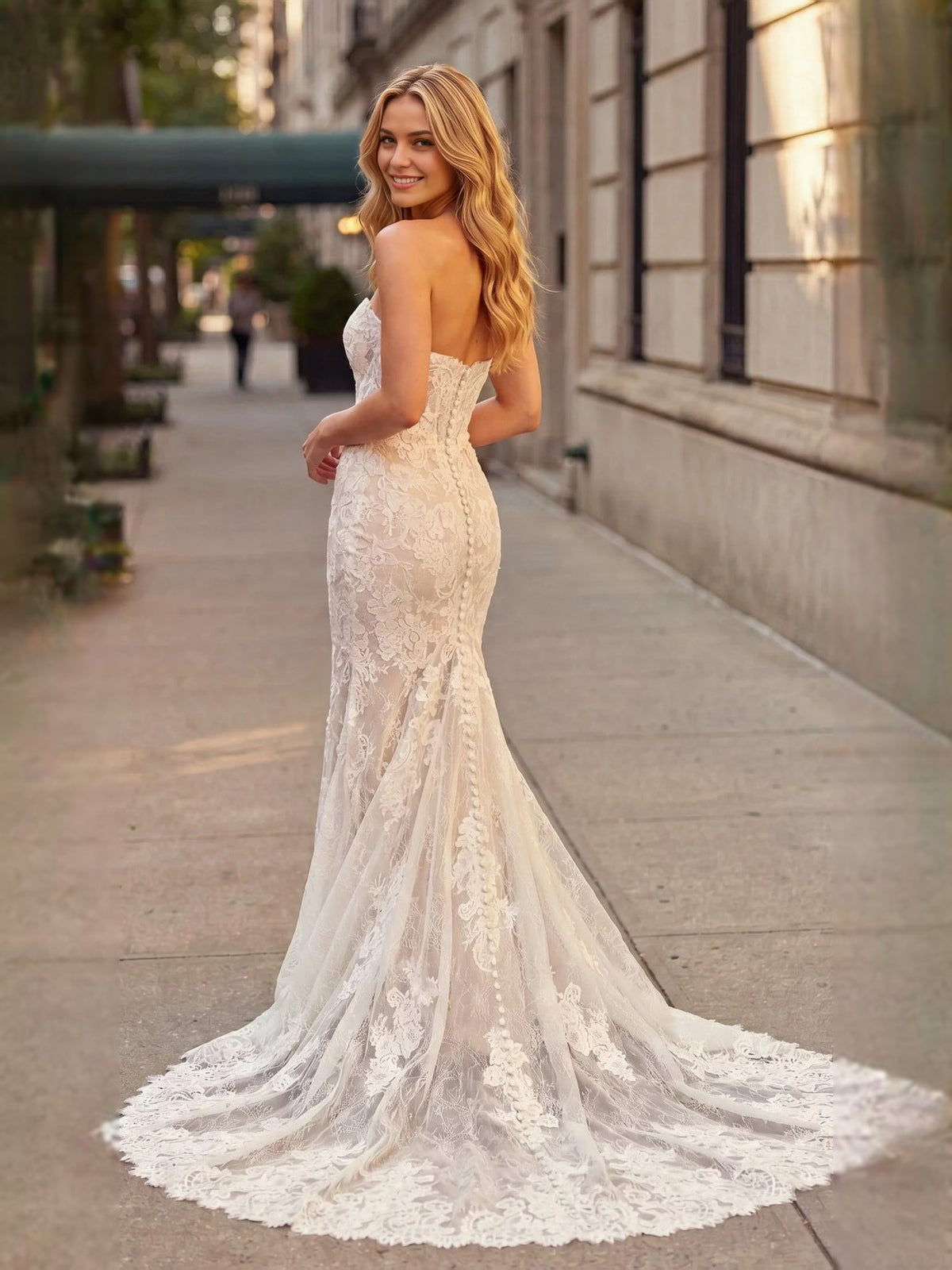 Ivory lace mermaid wedding dress with sweetheart neckline and flowing train