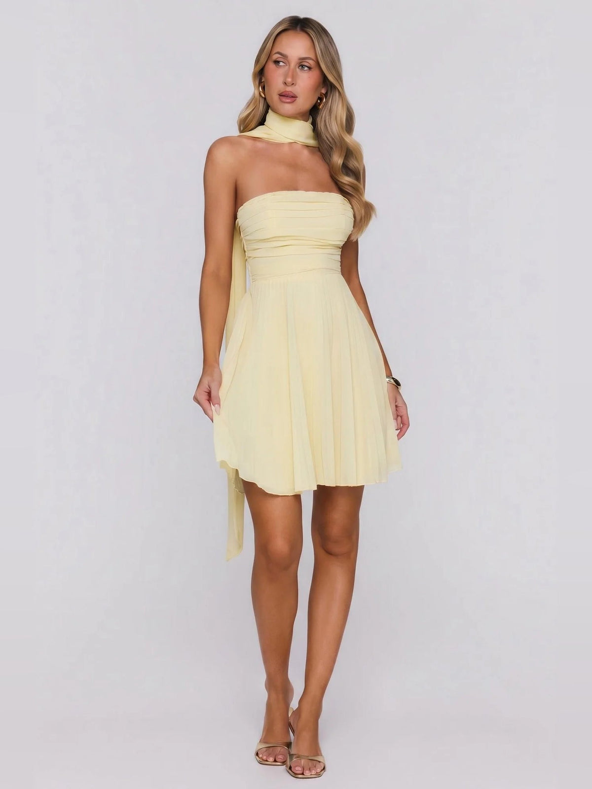 Lemon yellow strapless mini dress with pleated waistline and layered skirt