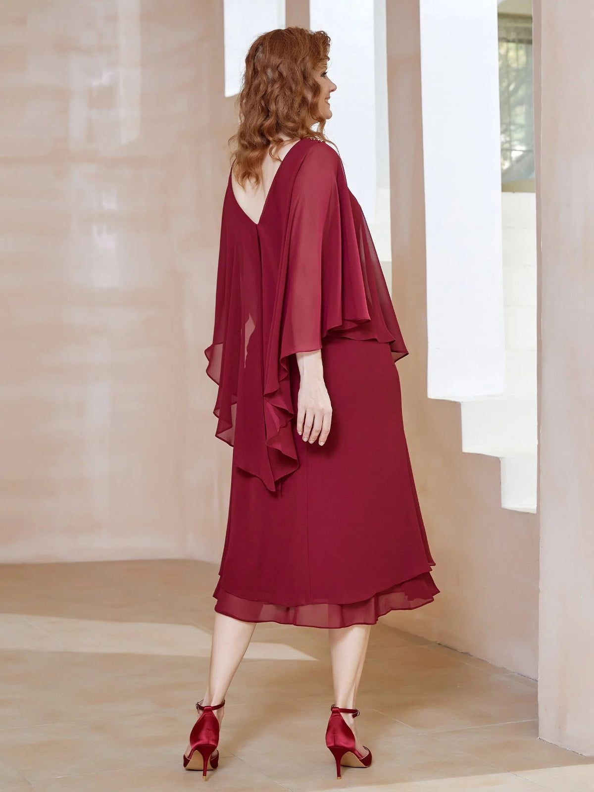 Burgundy midi dress with draped chiffon cape sleeves and A-line silhouette